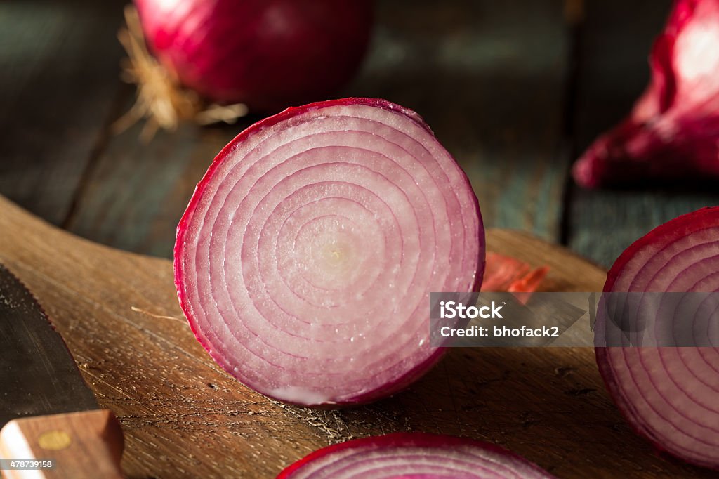 Raw Organic Red Onions Raw Organic Red Onions on a Background 2015 Stock Photo