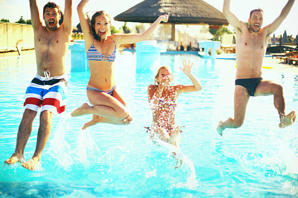 istock Group of people juming in swimming pool. 478740654