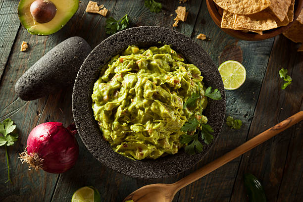 Homemade Fresh Guacamole and Chips Homemade Fresh Guacamole and Chips Ready to Eat guacamole photos stock pictures, royalty-free photos & images