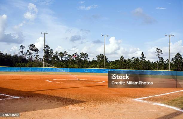 Watering The Softball Field Stock Photo - Download Image Now - Baseball Diamond, Day, Dirt