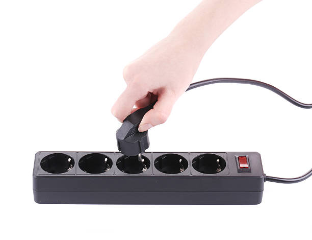istock Hand puts the plug in an extension cord 478741771
