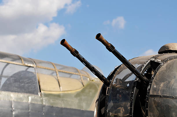 WW2 Lancaster Bomber Front Turret The twin .303 Browning machine guns on the front turret of a World War Two RAF Lancaster Bomber.Part of the cockpit of another Lancaster bomber can be seen in the background. lancaster texas stock pictures, royalty-free photos & images