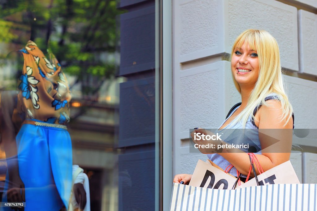 Look at that great dress! Look at that great dress! Window display from the street  with ample copyspace. 2015 Stock Photo