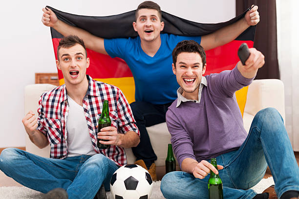 istock Excitement men cheering football match 478745777