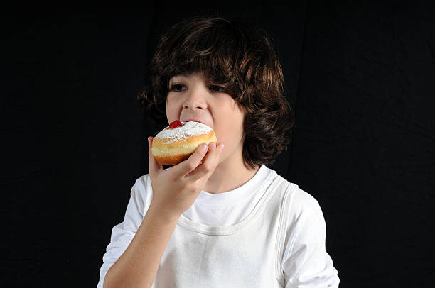 Boy Eating tasty sweets stock photo