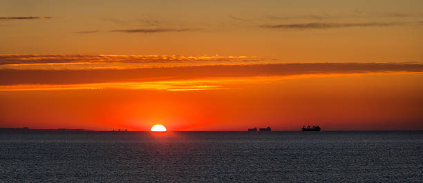 istock Seascape with big Industrial ships at sunrise. 478747226