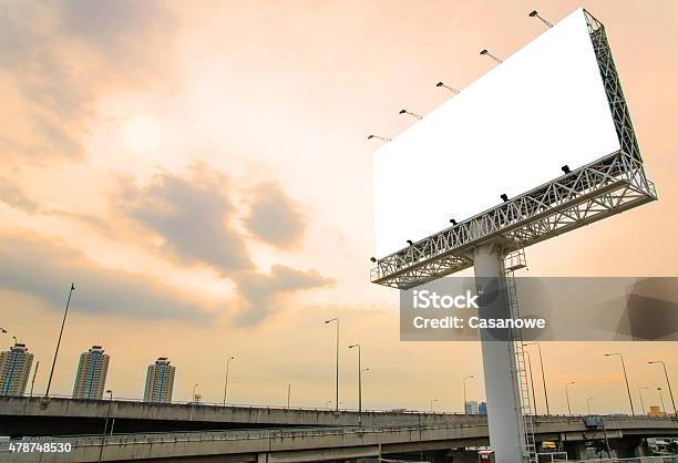 Large Blank Billboard On Road With City View Background Stock Photo - Download Image Now