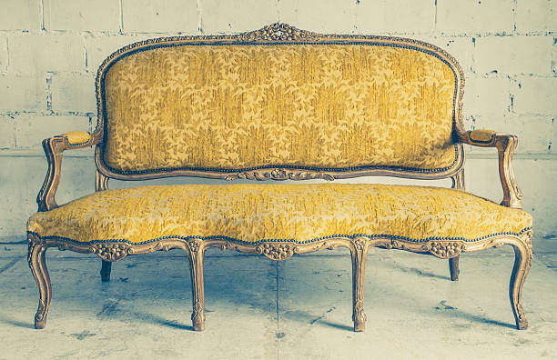istock Vintage luxury yellow sofa with white brick wall background 478748876