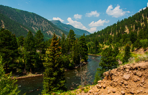 Colorado Rio Grande Mountain Velley Winding Fresh Water River with huge pine trees, natural wilderness, clean , fresh water , save our environment , Rocky mountain slopes and peaks in the distance , amazing landscape , Rochetzky , Blue sky , Southwest , America , Nature , 