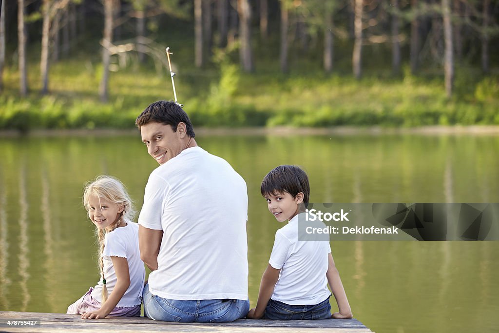 Family Father and children fishing in the lake 30-39 Years Stock Photo