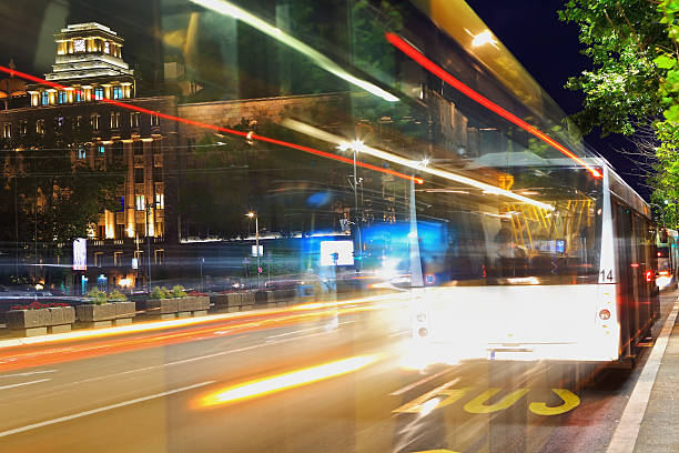 The time-lapse evening street with bright yellow lights.