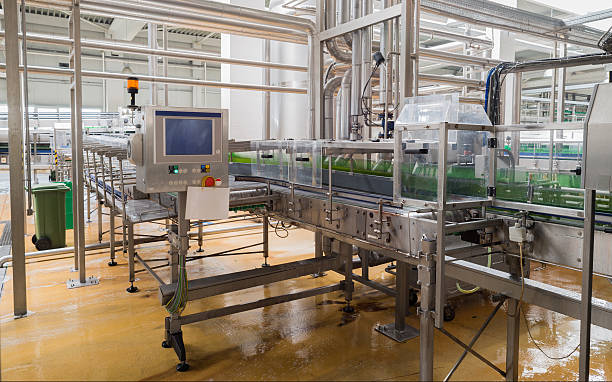 istock Conveyer belt line loaded with beer bottles in a brewery 478760366