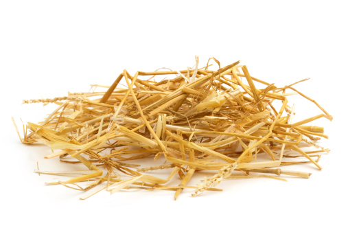 close up of straw isolated on white background
