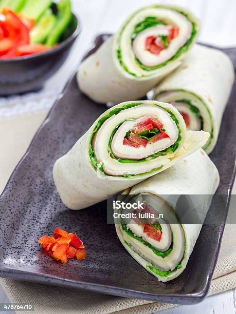 Tortilla Roll With Soft Cheese Chicken Ham And Vegetables Stock Photo - Download Image Now
