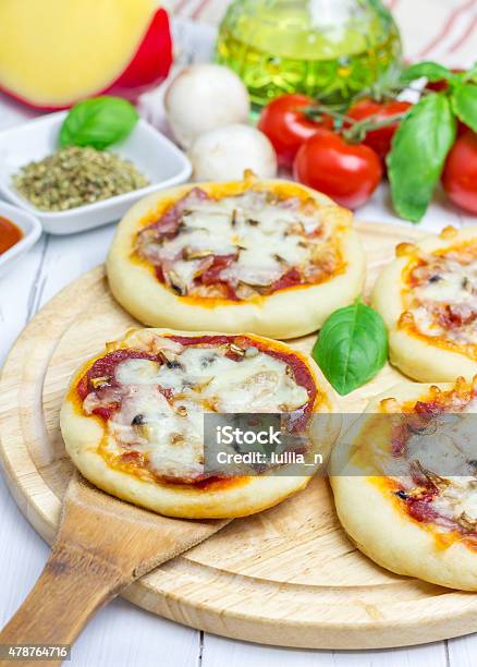 Mini Pizza With Salami Bacon Mushrooms And Cheese Stock Photo - Download Image Now