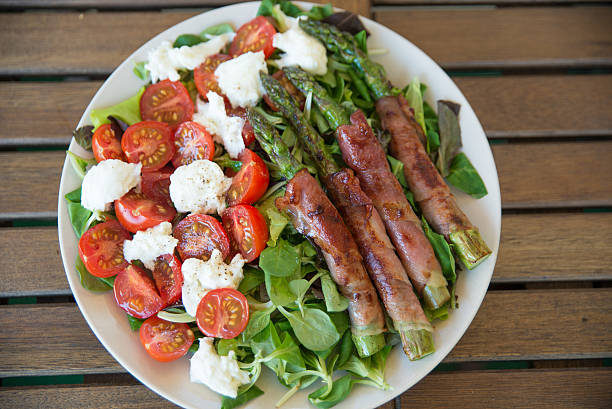 in bacon wrapped asparagus with caprese salad
