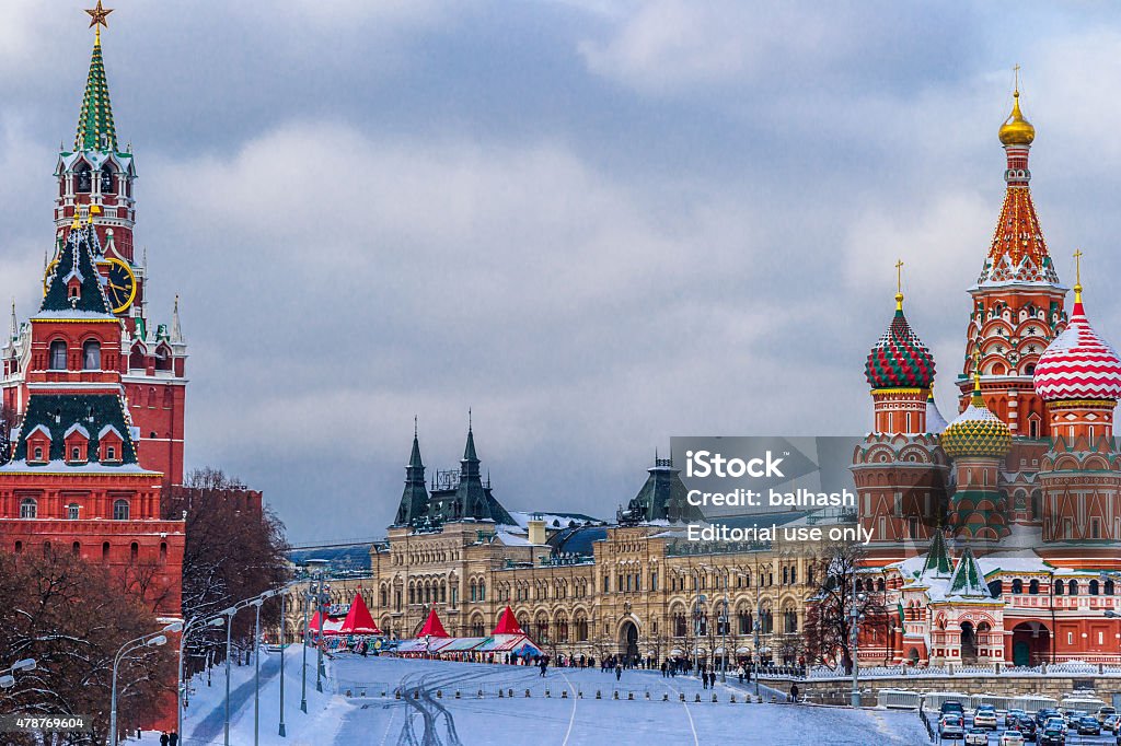 Moscow Red Square in winter Moscow, Russia - January 24, 2013: Moscow Red Square in winter. The Kremlin towers (left) skating rink on Red Square (center), St. Basil's cathedral (right). Moscow Kremlin, palaces and cathedrals as viewed in daytime in different seasons. The Kremlin is registered as UNESCO world heritage site. 2015 Stock Photo