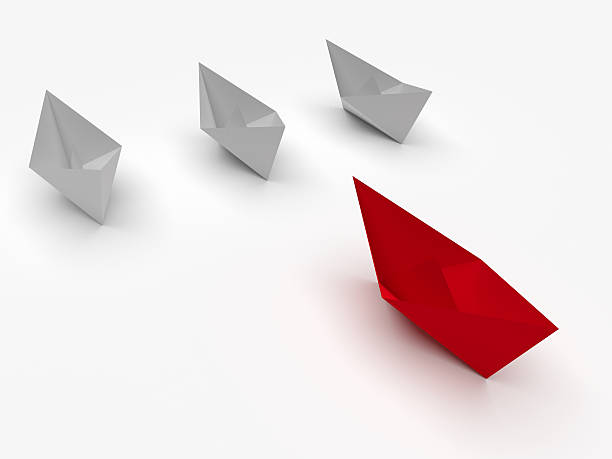 istock Leadership concept. Red and white paper boats 478770082