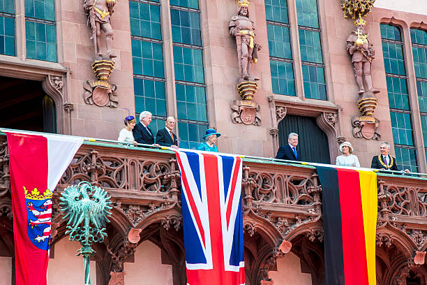 queen Elizabeth greets the audience from the balcony Frankfurt, Germany - June 25, 2015: queen Elizabeth greets the audience from the balcony at the town hall in Frankfurt, Germany. It is her first visit to Frankfurt and Hesse prime Minister Volker Buffier invited her. prince phillip stock pictures, royalty-free photos & images