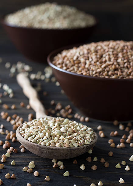 istock Green and brown buckwheat in ceramic bowls 478774460