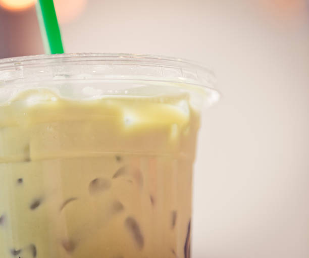 istock Matcha  with green straw in creamy tone 478774502