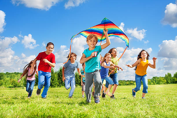 istock Boys and girls with kite 478775401