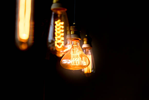 istock Hanged  orange decoration light bulbs focus on pear shape  one 478775946