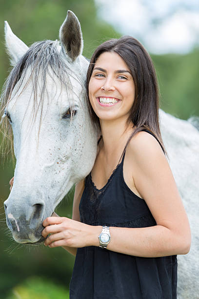 istock Young woman with her horse 478776186