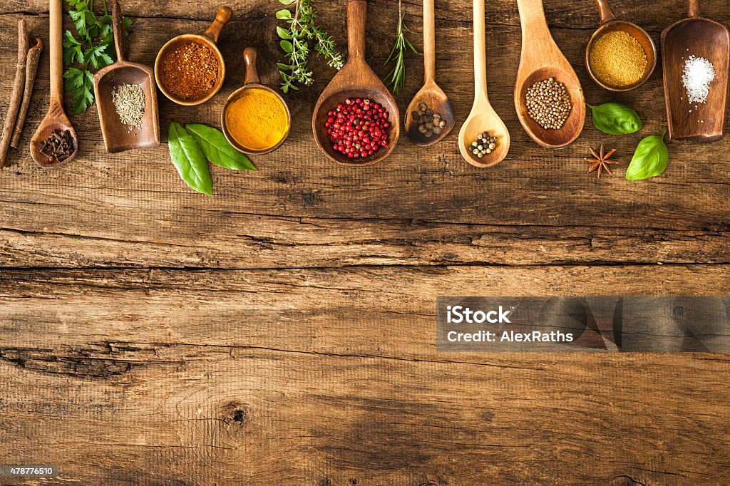Colorful spices on wooden table Various colorful spices on wooden table Spice Stock Photo