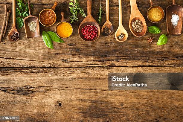 Colorful Spices On Wooden Table Stock Photo - Download Image Now - Spice, Cooking, Wood - Material