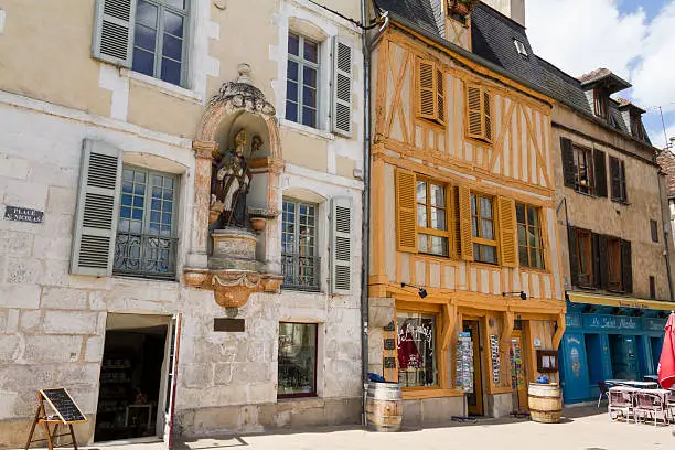 Small square at Auxerre, France, named after St. Nicolas whose statue is placed in the wall of a house.