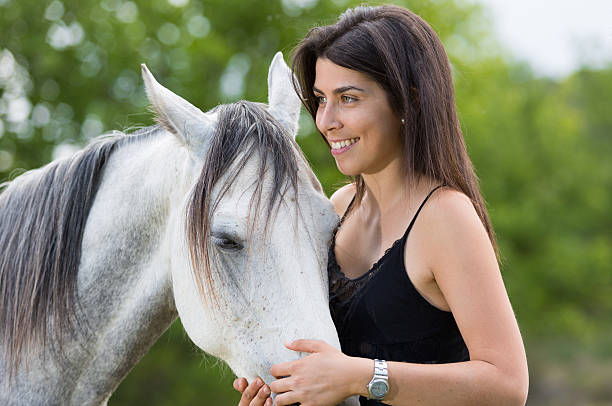 istock Young woman with her horse 478781348