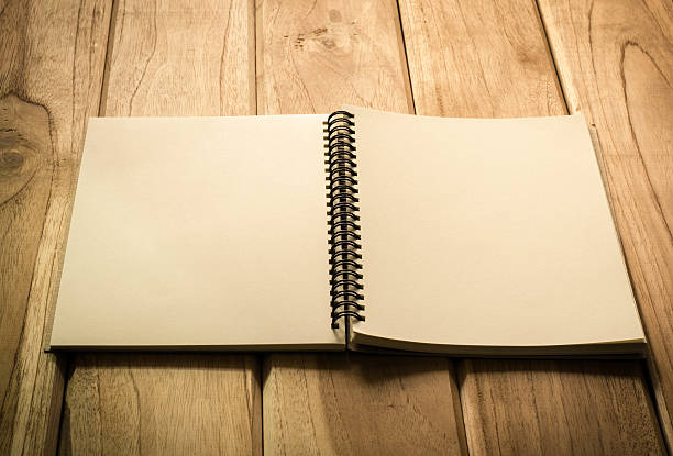 istock blank notebook with pencil on wooden table 478785810