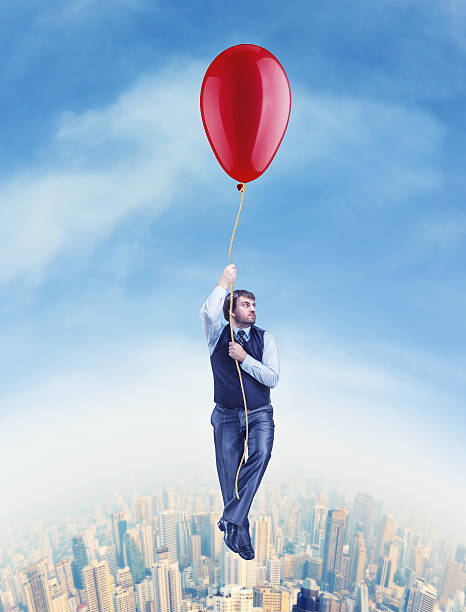istock Businessman flying on the big ballon 478786336