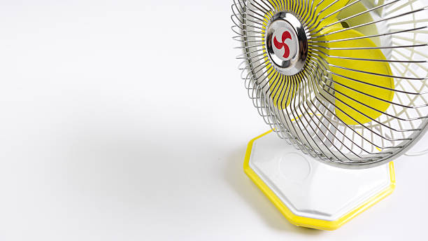 istock Portable yellow mini fan isolated on white background 478786910