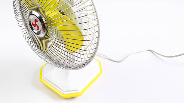 istock Portable yellow mini fan isolated on white background 478786922