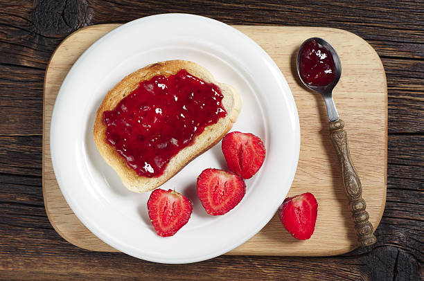istock Toasted bread with jam and strawberry 478786988