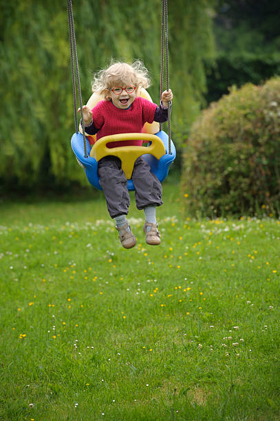 istock little toddler on a swing 478787138