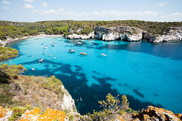 cala macarella - environment nature tranquil scene nautical vessel stock-fotos und bilder