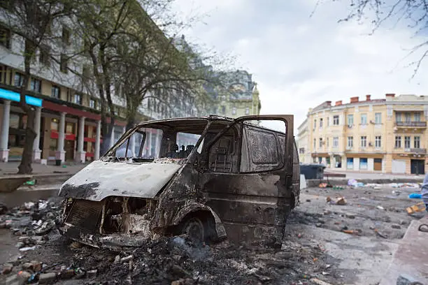 Burned car in the center of city after unrest in Odesa, Ukraine
