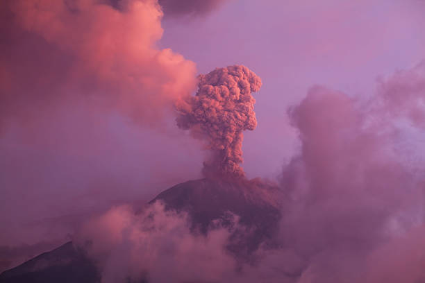 Tungurahua Volcano Smoldering Tungurahua volcano explosion on february 2014 at sunset mt tungurahua sunset mountain volcano stock pictures, royalty-free photos & images