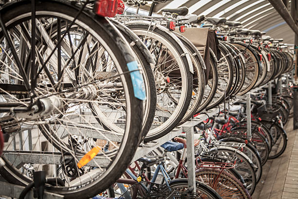 Bicycle parking Double line of parked bicycles in Denmark. bicycle rack photos stock pictures, royalty-free photos & images