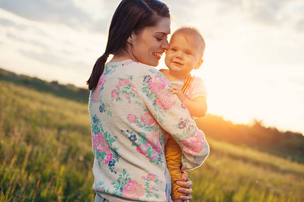istock mother with her baby in the park 478792016