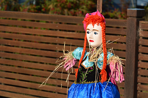European woman scarecrow in the garden