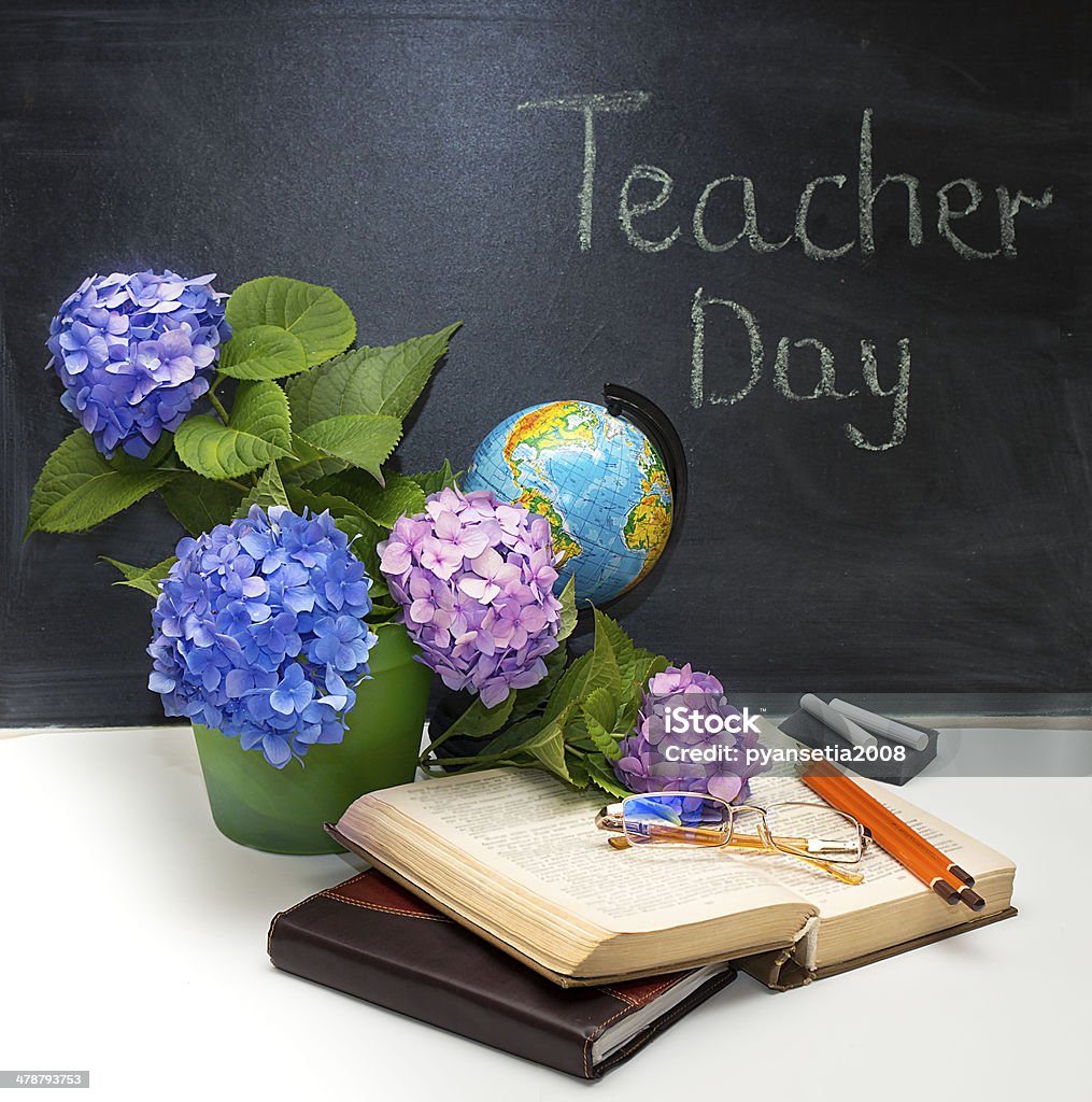 Flowers hydrangeas and school subjects. Flower  bouquet of hydrangea  with school subjects. Place for your text. Day of the teacher. Anniversary Stock Photo