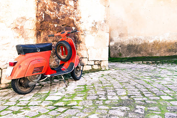 istock Vintage Red Italian Scooter Against Mottled Old Wall 478794816