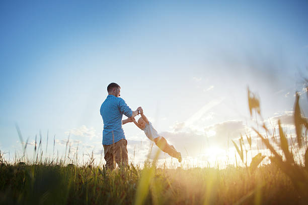 istock father and his son in the park 478795366