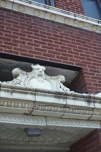 Gargoyle above Apartment Entrance stock photo