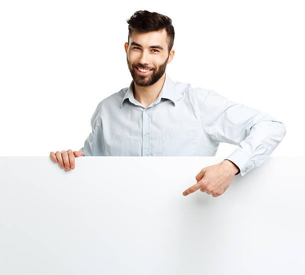 istock Young bearded man showing blank signboard, isolated over white 478801162