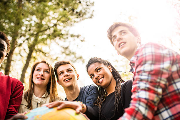 istock teenagers college student smiling with globe 478801192